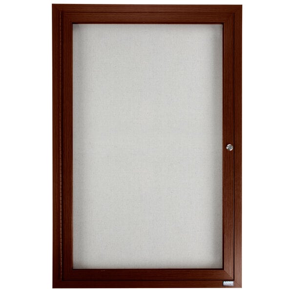 A brown framed bulletin board with white lighting inside.