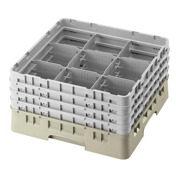 A beige plastic Cambro glass rack with 9 compartments and 3 extenders.