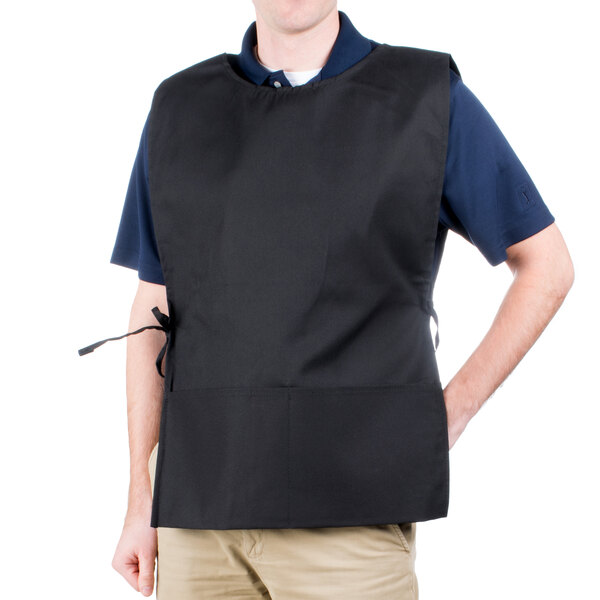 A man wearing a black Intedge cobbler apron with two pockets.