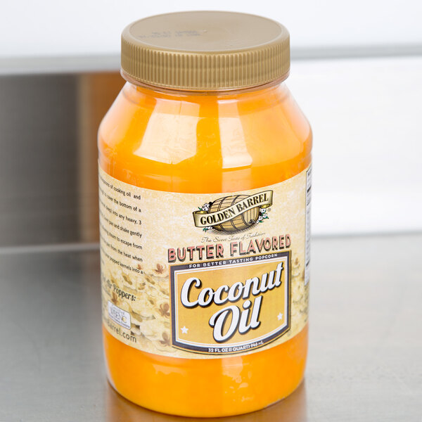 A case of 12 Golden Barrel Butter Flavored Coconut Oil jars on a counter.