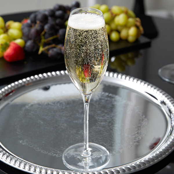 A Reserve by Libbey Rivere flute of champagne on a silver tray.