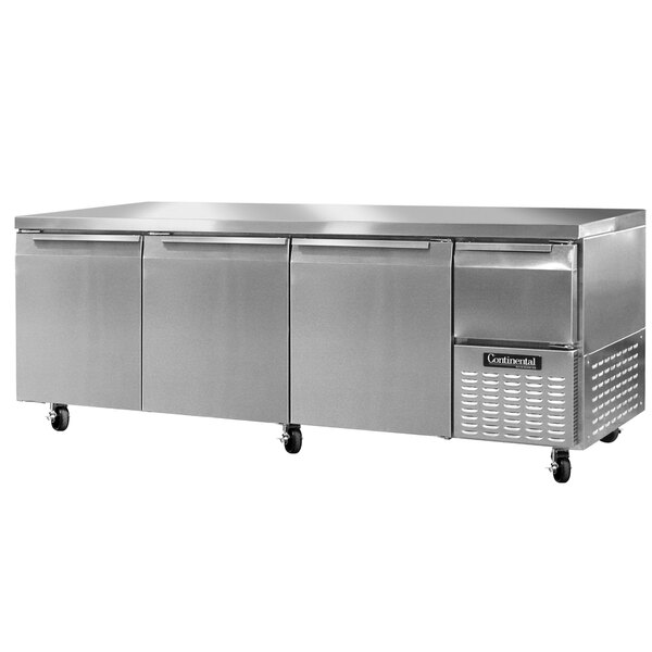 A stainless steel Continental undercounter refrigerator with three drawers.