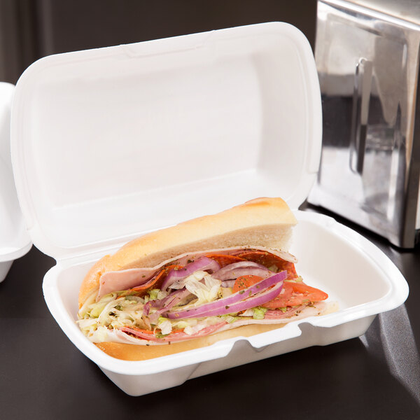 A sandwich in a Genpak foam takeout container.