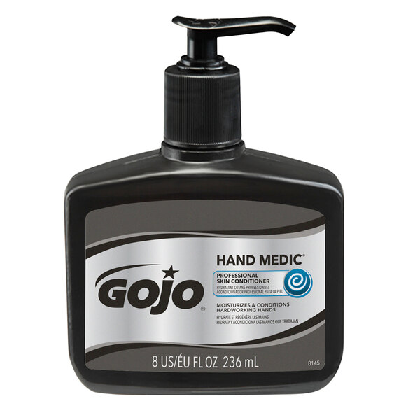 A black bottle of GOJO Hand Medic professional skin conditioner with a black label.