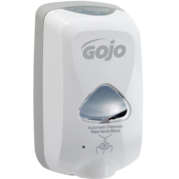 A white GOJO® touchless soap dispenser on a counter.