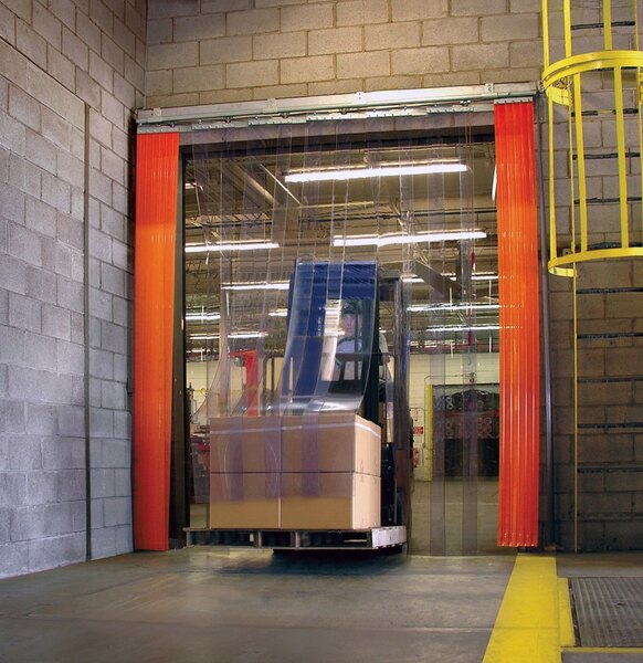 A warehouse with a forklift and yellow PVC strip curtains.