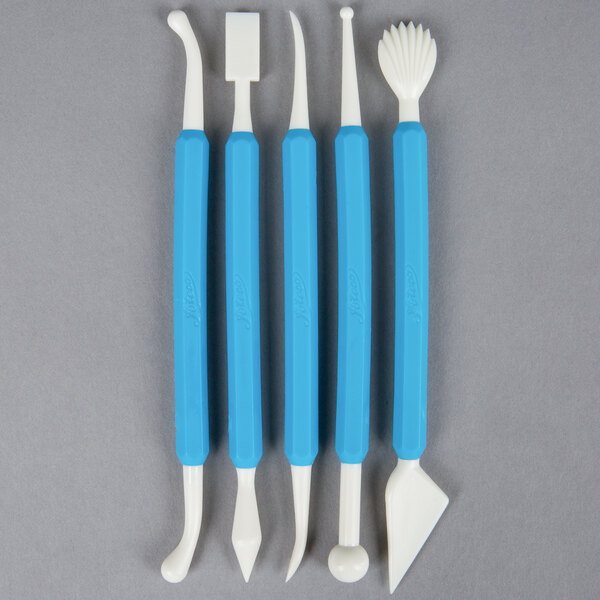 A blue rectangular package containing Ateco cake sculpturing tools.