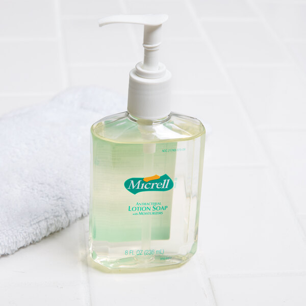 A Micrell plastic bottle of liquid hand soap with a pump.