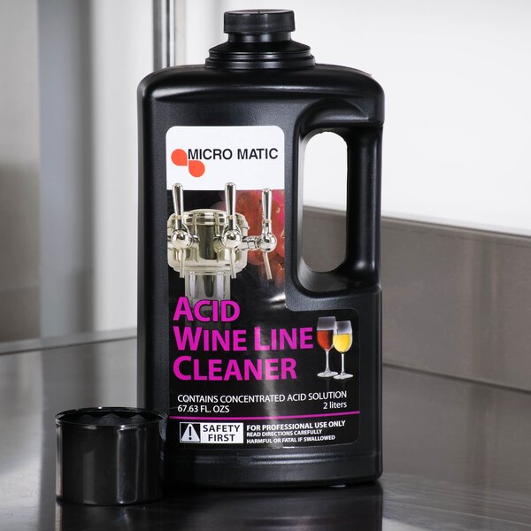 A black bottle of Micro Matic Acid Wine Line Cleaner with a white label.