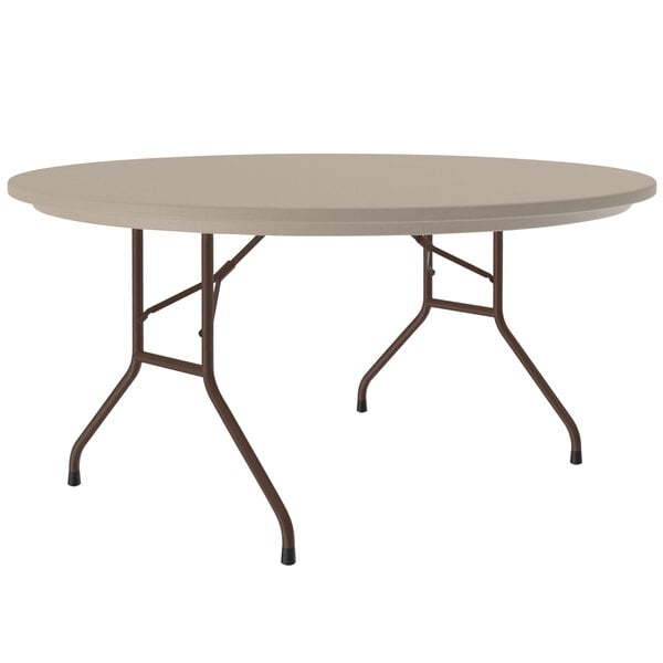A Correll round folding table with a mocha granite surface and metal legs.