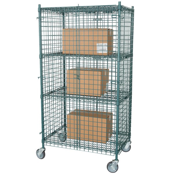A Regency green wire security cage with boxes inside.