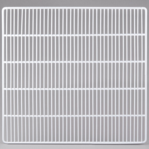 A grey metal grid shelf with a grid pattern.