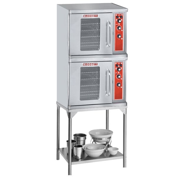 A large stainless steel Blodgett double deck commercial convection oven with red knobs.