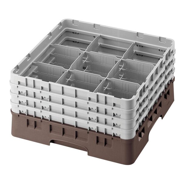 A brown plastic Cambro glass rack with 9 compartments and 3 extenders.