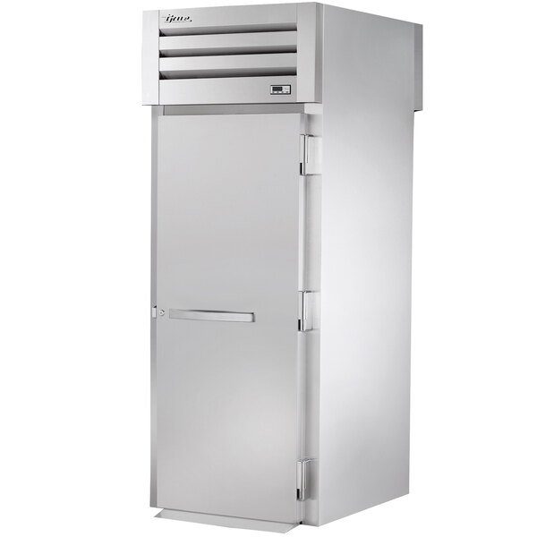 A True stainless steel roll-through refrigerator with a solid door and silver handle.