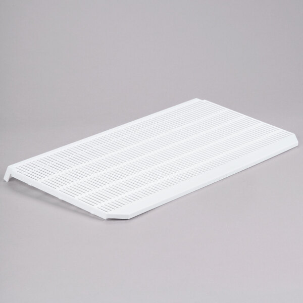 A white plastic grid with a handle.