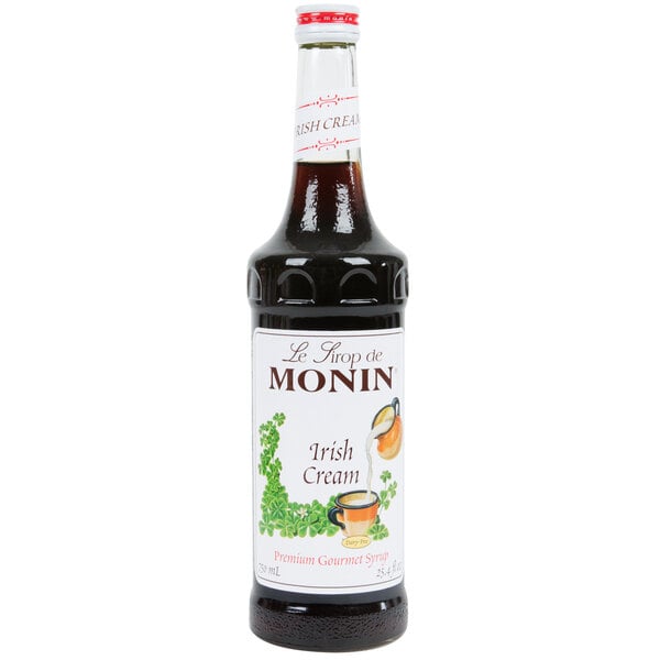 A bottle of Monin Irish Cream syrup with a white label.
