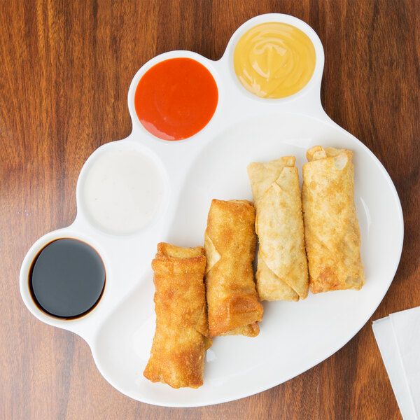An American Metalcraft Prestige porcelain plate with fried spring rolls and dipping sauce.