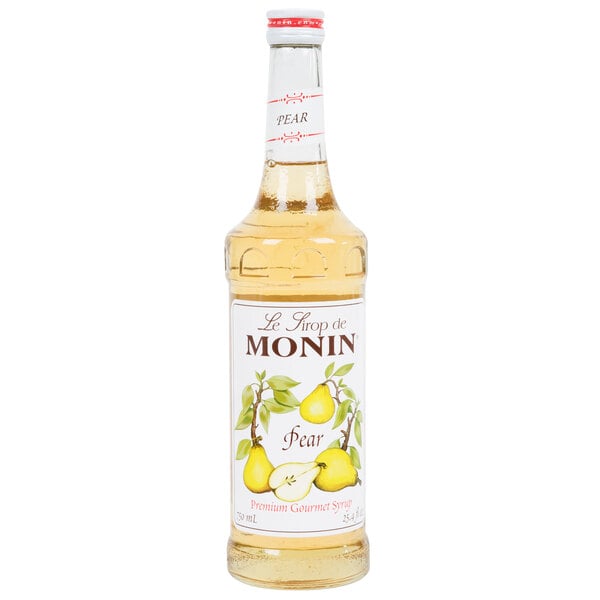 A bottle of Monin pear syrup with a white label.