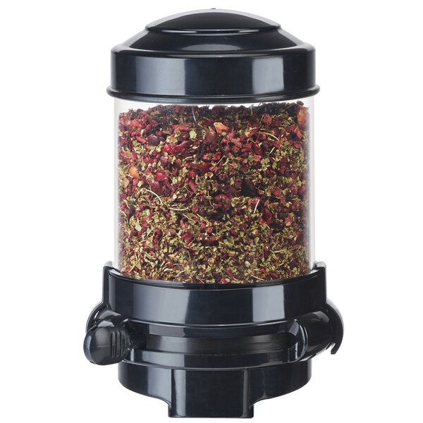 A black Cal-Mil wall-mounted container filled with tea leaves.