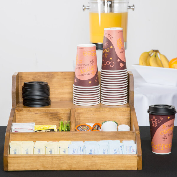 A Cal-Mil Madera condiment station with coffee and condiments on a table.