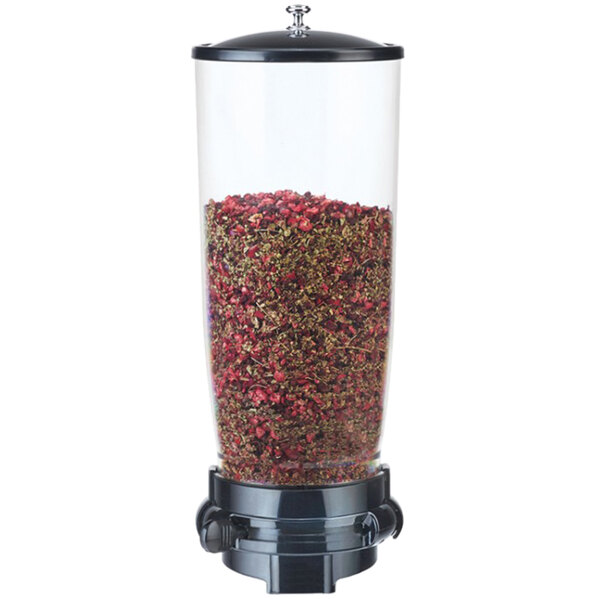 A black Cal-Mil wall mount dispenser with a container full of dried herbs.