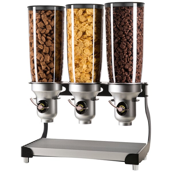 A black Cal-Mil triple cereal dispenser with different cereals in glass containers.