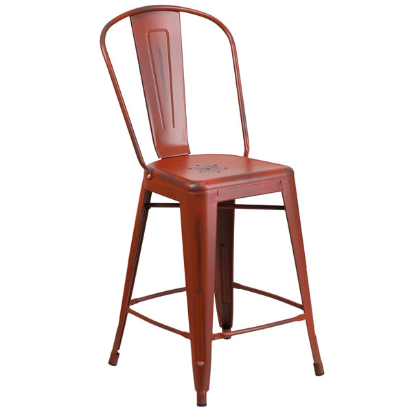 A red metal restaurant bar stool with a back and drain hole seat.