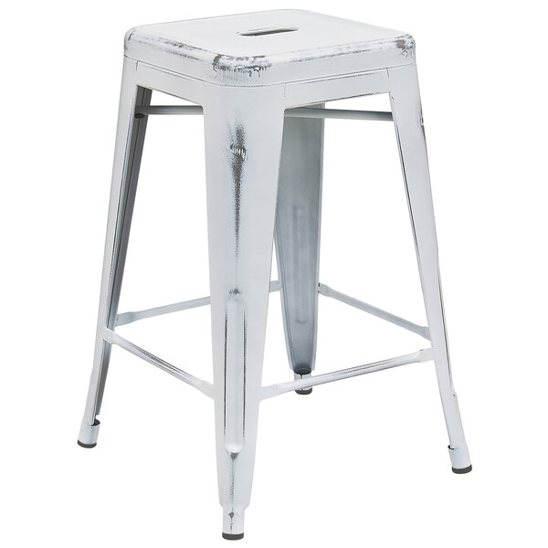 A Flash Furniture distressed white metal counter height stool with a square seat.