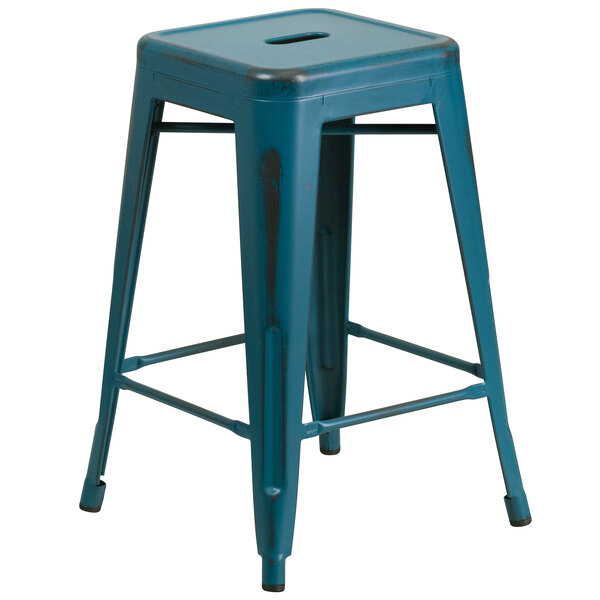 A Flash Furniture distressed Kelly blue metal restaurant bar stool with a square seat.