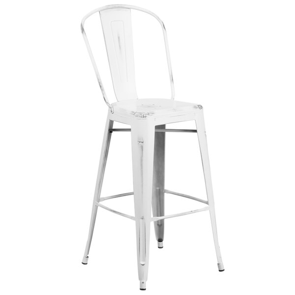 A white metal bar stool with a white slat back.