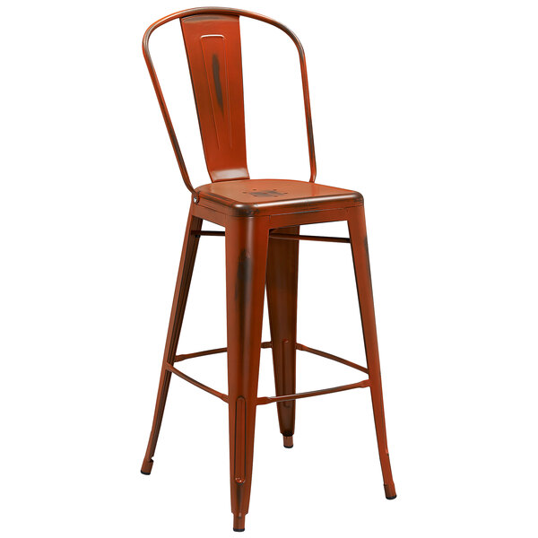 An orange metal bar stool with a vertical slat back and drain hole seat.