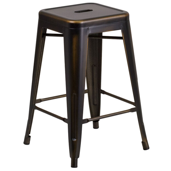 A black metal Flash Furniture stackable counter height stool with a square wooden seat on a table in a bar.