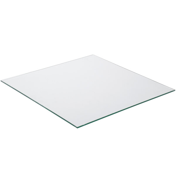 A square glass plate with a green border.