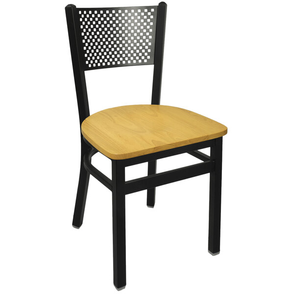 A BFM Seating black metal side chair with a natural wood seat.