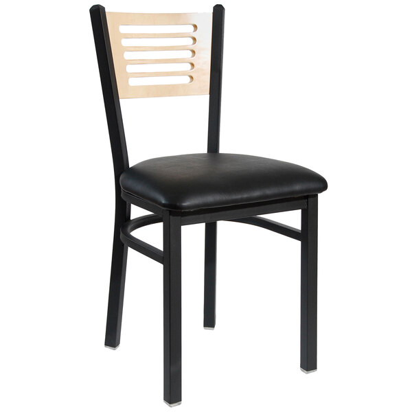 A black metal BFM Seating restaurant chair with a light wood back.