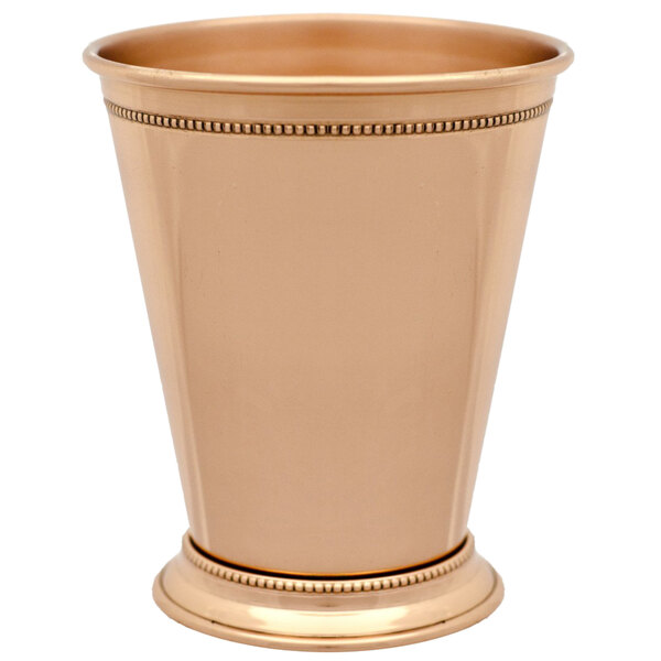 A gold 10 Strawberry Street metal cup with beaded trim.