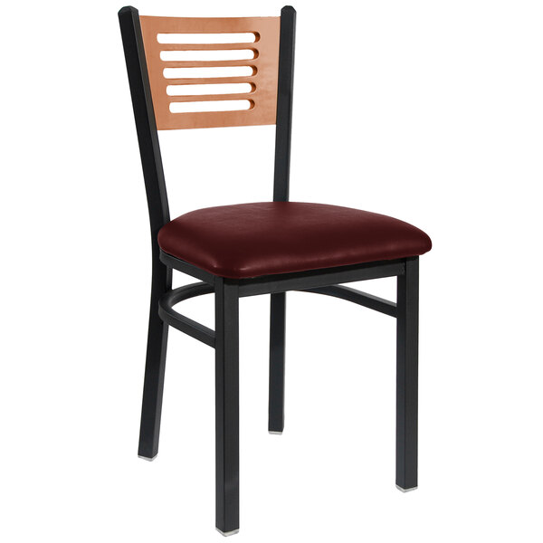 A BFM Seating black metal side chair with a cherry wooden back and burgundy vinyl seat.