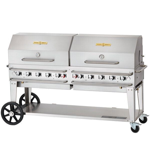A silver Crown Verity Pro Series outdoor grill with two burners and wheels.