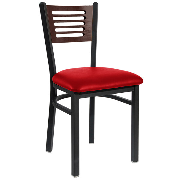 A BFM Seating black metal side chair with a red vinyl seat.