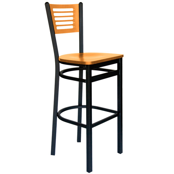 A BFM Seating black metal bar stool with a wooden seat and back.