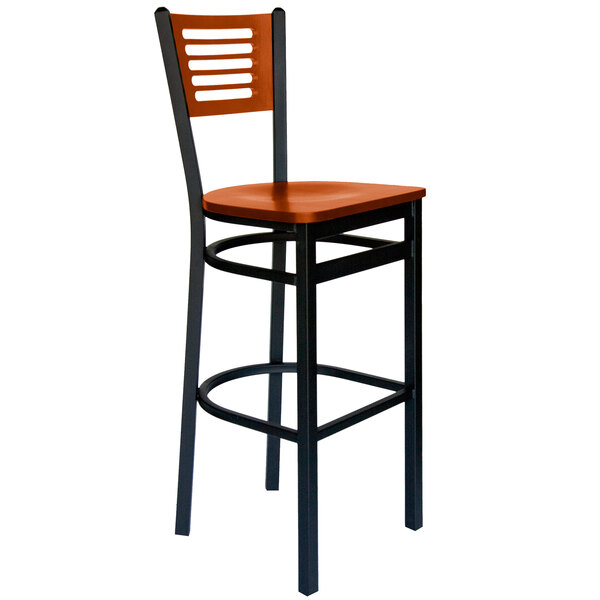 A BFM Seating black metal bar chair with a cherry wood back and seat.