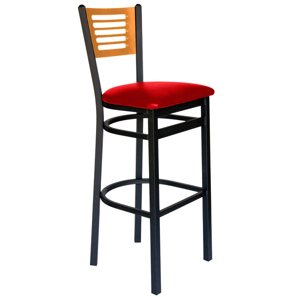 A BFM Seating black metal bar chair with a red vinyl seat.