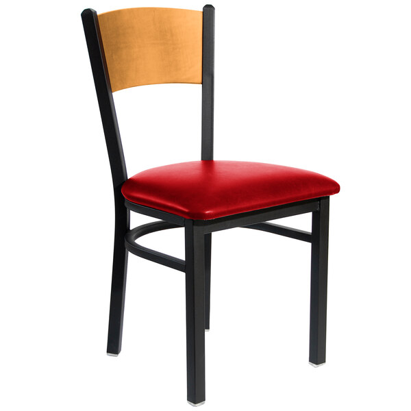 A BFM Seating black metal side chair with red seat and wooden back.