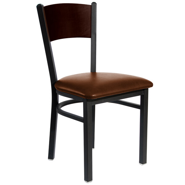 A BFM Seating black metal side chair with a brown vinyl seat and wooden back.
