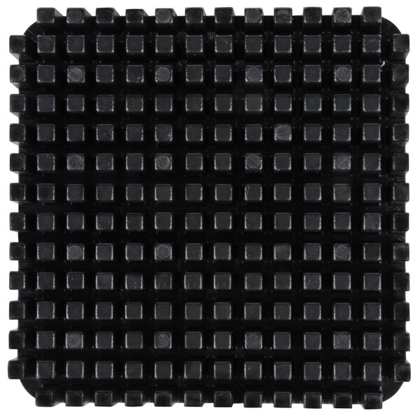 A black Garde push block with small squares on it.