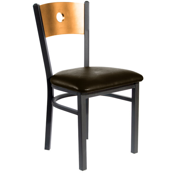 A black metal restaurant chair with a natural wood back and dark brown seat.