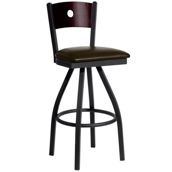 A BFM Seating black metal bar stool with mahogany wooden back and dark brown vinyl seat.
