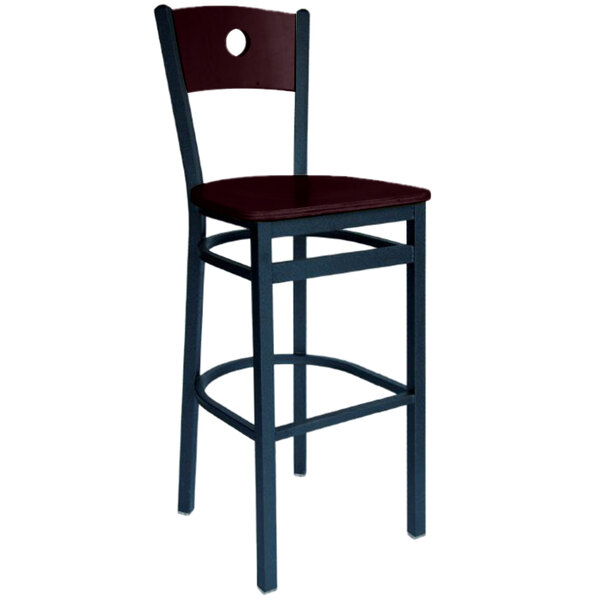 A BFM Seating black metal bar stool with a mahogany wooden back and seat.