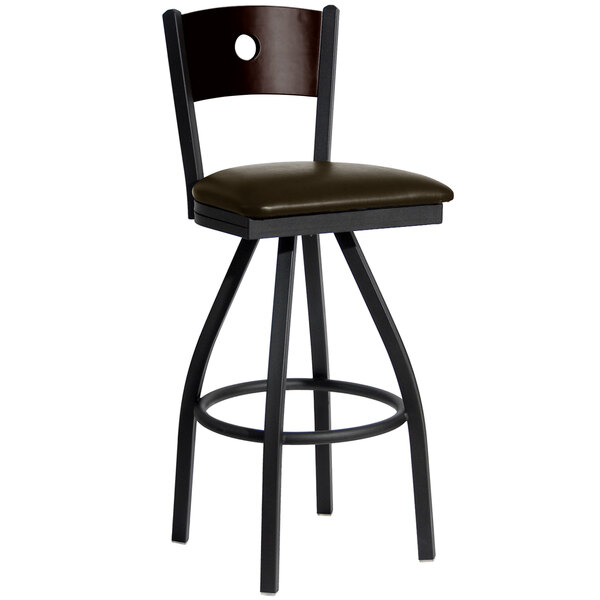 A BFM Seating black metal bar stool with a round walnut back and dark brown vinyl seat.